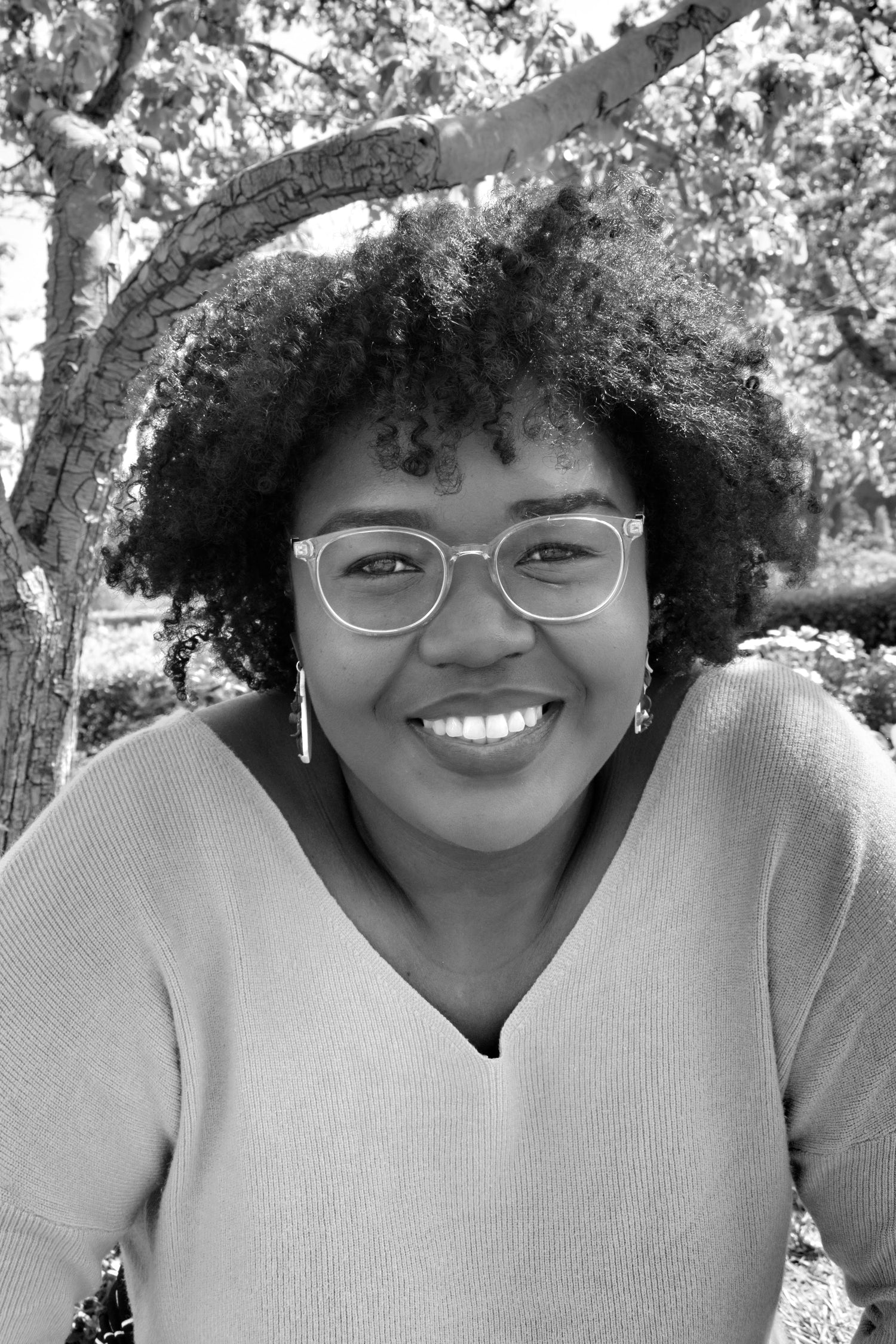 Black and white photo of Ackelia Williams smiling.